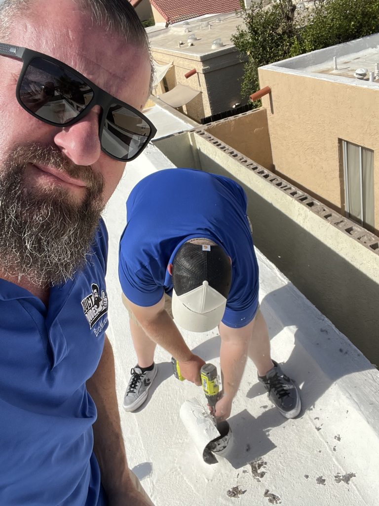 Duct Dudes technicians servicing a rooftop Dryer Vent in Scottsdale, AZ